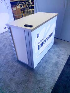 RENTAL: Modified RE-1077 with Storage Closet with Locking Door, (2) Lightboxes, 47" Monitor, RE-1567 Backlit Counter, and SEG Fabric Graphics